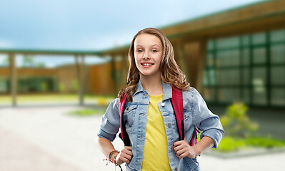 Image showing happy smiling teenage student girl with school bag