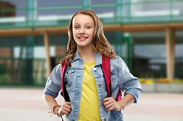 Image showing happy smiling teenage student girl with school bag