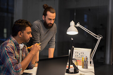 Image showing creative team with computer working late at office