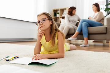 Image showing student girl with notebook and dreaming at home