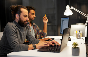 Image showing creative team with computer working late at office