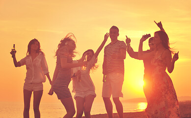 Image showing Group of young people enjoy summer  party at the beach