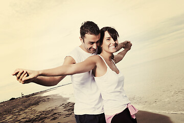 Image showing happy young couple have fun at beautiful beach