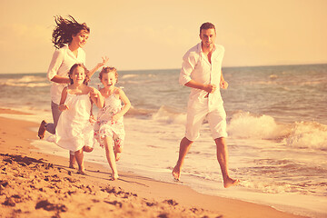 Image showing happy young  family have fun on beach