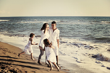 Image showing happy young  family have fun on beach