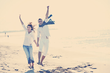 Image showing happy young couple have fun at beautiful beach