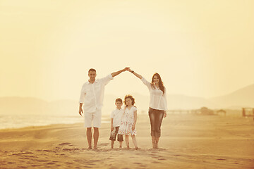 Image showing happy young family have fun on beach at sunset