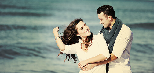 Image showing happy young couple have fun at beautiful beach