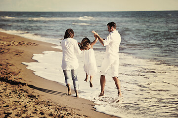 Image showing happy young  family have fun on beach