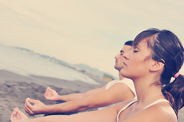 Image showing couple yoga beach