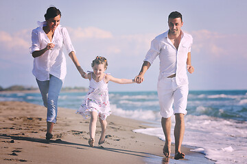 Image showing happy young  family have fun on beach