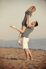 Image showing happy young couple have fun on beach