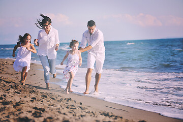 Image showing happy young  family have fun on beach