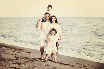 Image showing happy young family have fun on beach