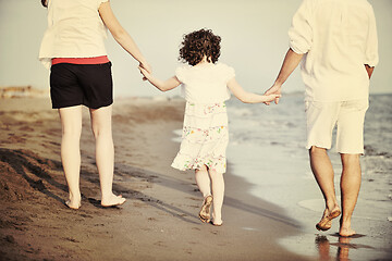 Image showing happy young family have fun on beach