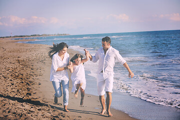 Image showing happy young  family have fun on beach