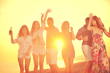 Image showing Group of young people enjoy summer  party at the beach