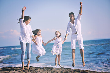 Image showing happy young  family have fun on beach