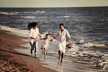 Image showing happy young  family have fun on beach