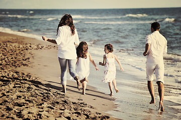 Image showing happy young  family have fun on beach