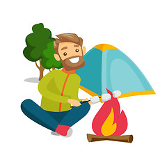 Image showing Caucasian man roasting marshmallow over campfire.