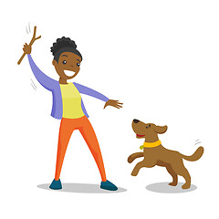 Image showing African-american woman training dog with stick.