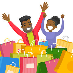 Image showing Young african couple sitting among shopping bags.