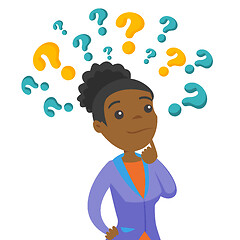 Image showing Business woman thinking under question marks.