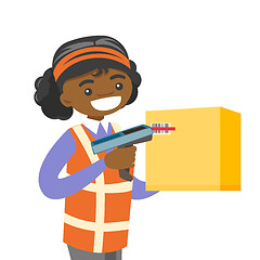 Image showing African warehouse worker scanning barcode on box.