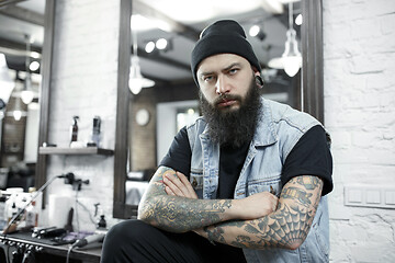 Image showing The male hairdresser against a barber shop background.