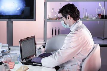 Image showing Scientist working in corona virus vaccine development laboratory research facility.