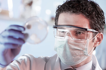 Image showing Scientist working in corona virus vaccine development laboratory research facility.