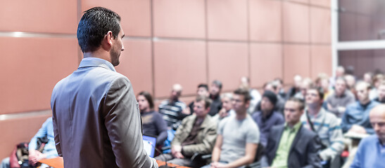 Image showing Public speaker giving talk at business event.