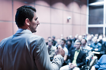 Image showing Public speaker giving talk at business event.