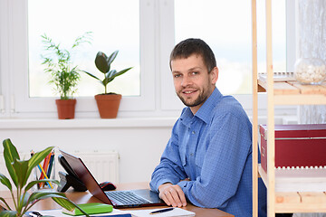 Image showing Successful businesswoman at her desk in the office