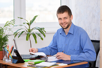Image showing Portrait of a successful office clerk in the workplace