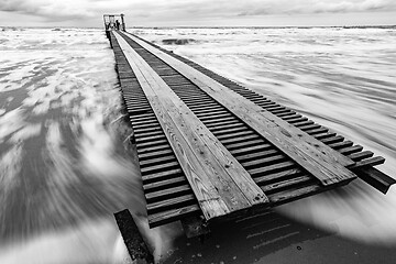 Image showing Long distance pier on the sea coast, black and white photo, long exposure