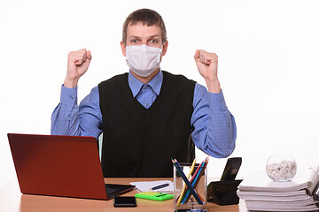 Image showing Office specialist in medical mask joyfully celebrates success