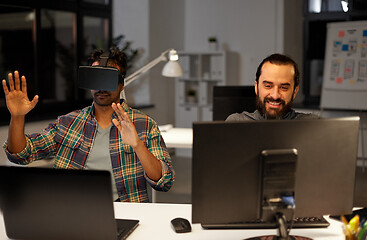 Image showing creative man in virtual reality headset at office