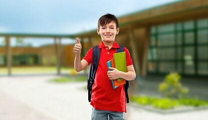 Image showing student boy with books and bag showing thumbs up