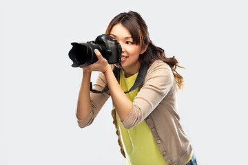 Image showing asian female photographer with digital camera