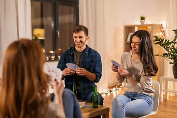 Image showing friends playing cards and drinking beer at home