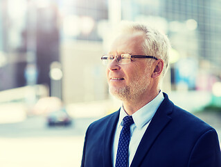 Image showing senior businessman on city street