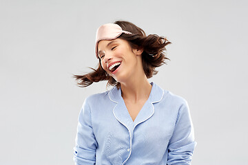 Image showing happy young woman in pajama and eye sleeping mask