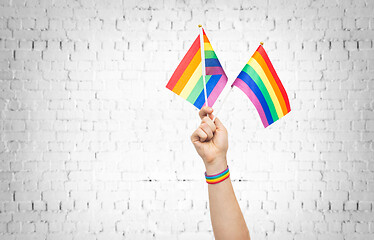 Image showing hand with gay pride rainbow flags and wristband