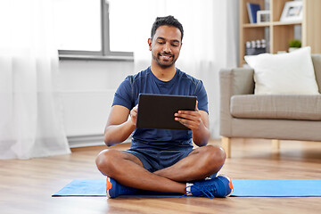 Image showing indian man with tablet pc and exercise mat at home