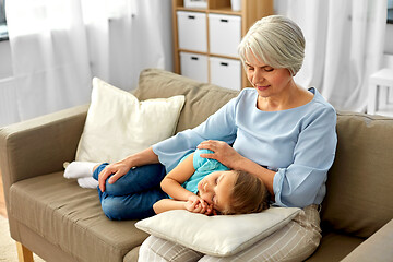 Image showing grandmother and granddaughter sleeping on pillow