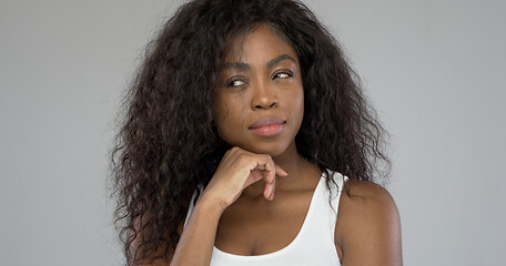 Image showing Thoughtful ethnic female looking away