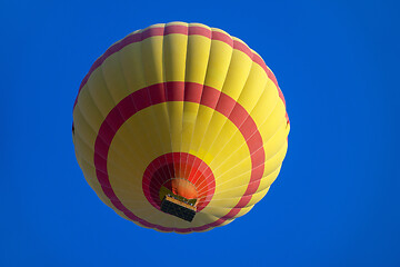 Image showing Yellow hot air baloon flying in sky