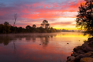 Image showing Beautiful sunrise over the billabong with a light ground fog